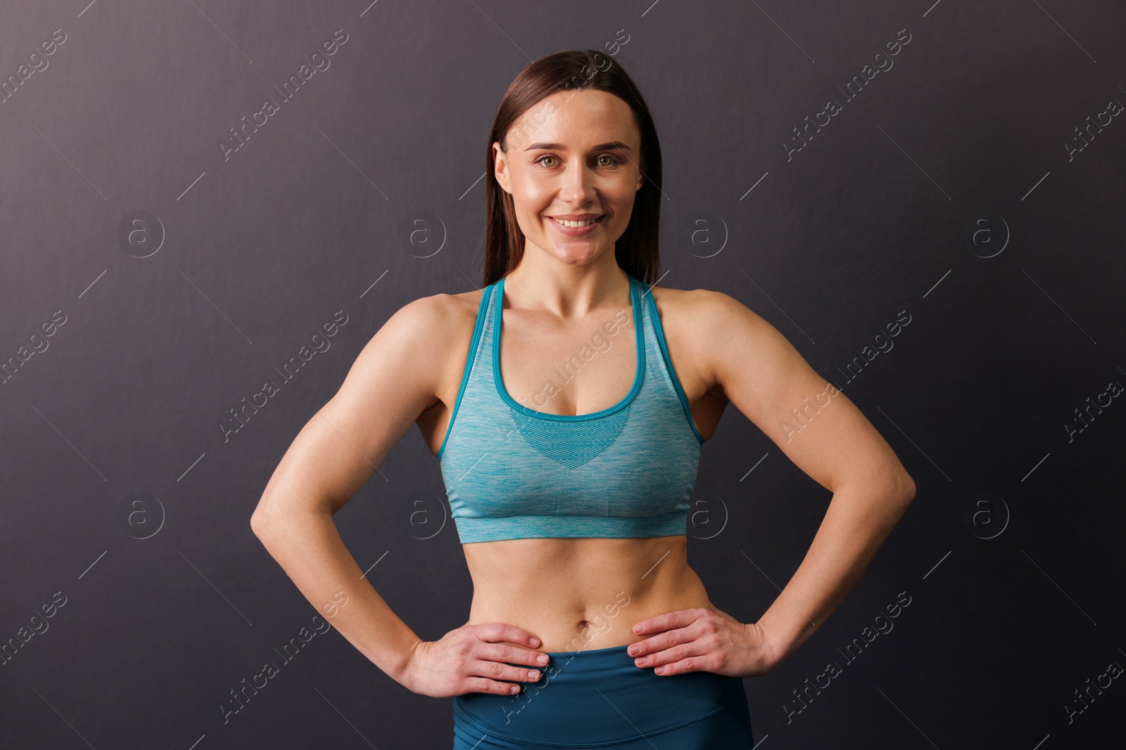 Portrait of professional trainer on black background Photo of Portrait of professional trainer on black background