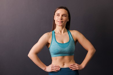 Photo of Portrait of professional trainer on black background