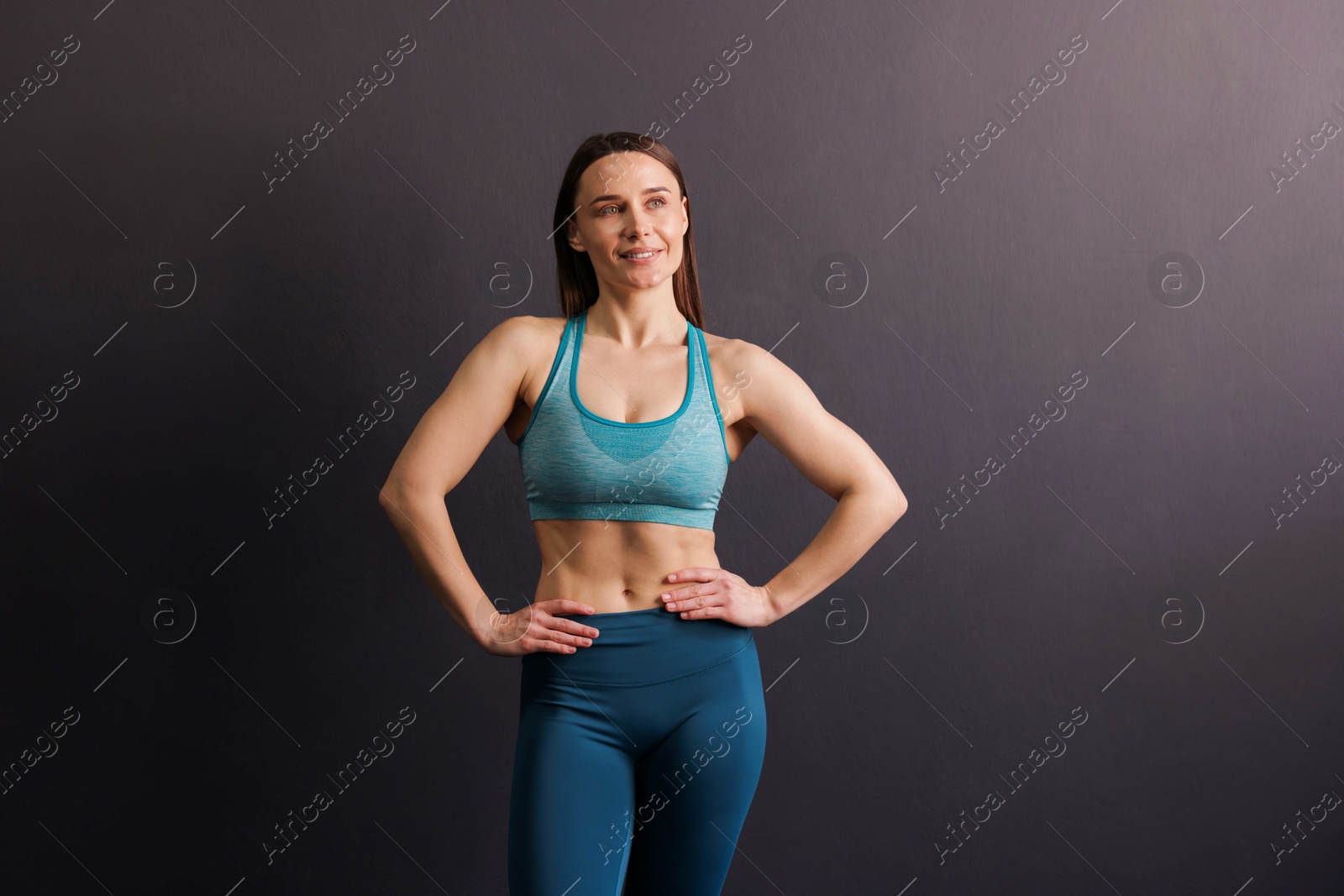 Portrait of professional trainer on black background Photo of Portrait of professional trainer on black background