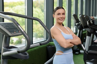 Photo of Portrait of professional personal trainer in sport center