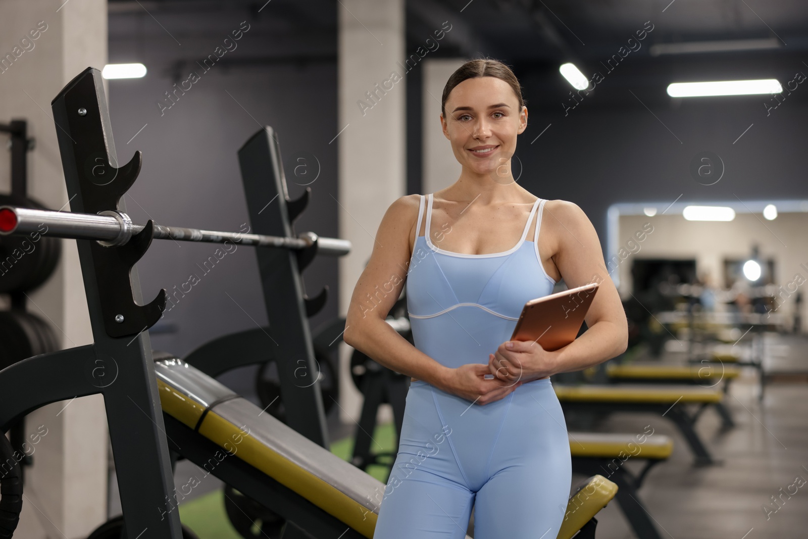 Professional personal trainer with tablet in gym Photo of Professional personal trainer with tablet in gym