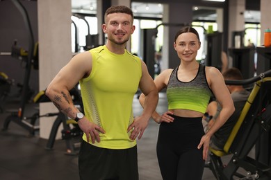 Photo of Portrait of professional personal trainers in gym