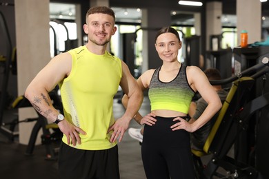 Photo of Portrait of professional personal trainers in gym