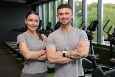 Photo of Portrait of personal trainers in sport center