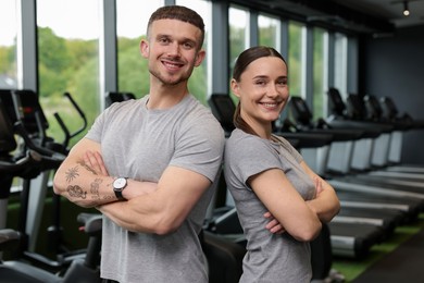 Photo of Portrait of personal trainers in sport center