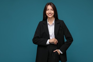 Photo of Happy woman in suit on light blue background