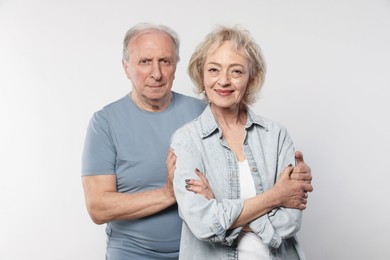 Photo of Portrait of lovely senior couple on white background