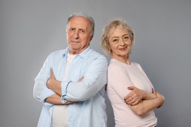Photo of Portrait of lovely senior couple on grey background