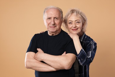 Photo of Portrait of lovely senior couple on beige background