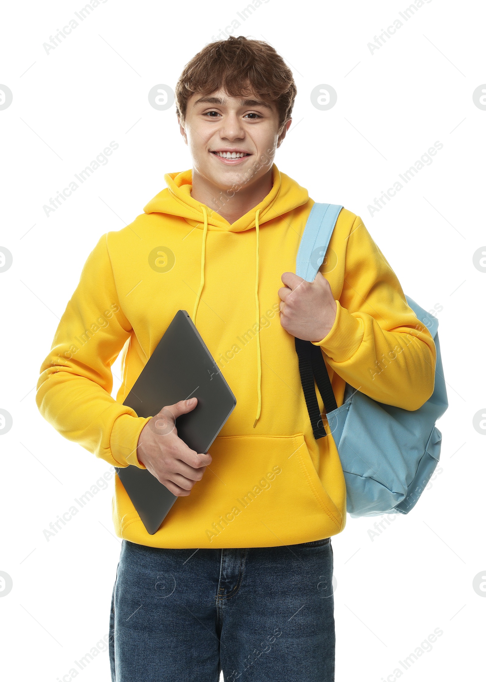 Teenage boy with laptop and backpack on white background Photo of Teenage boy with laptop and backpack on white background