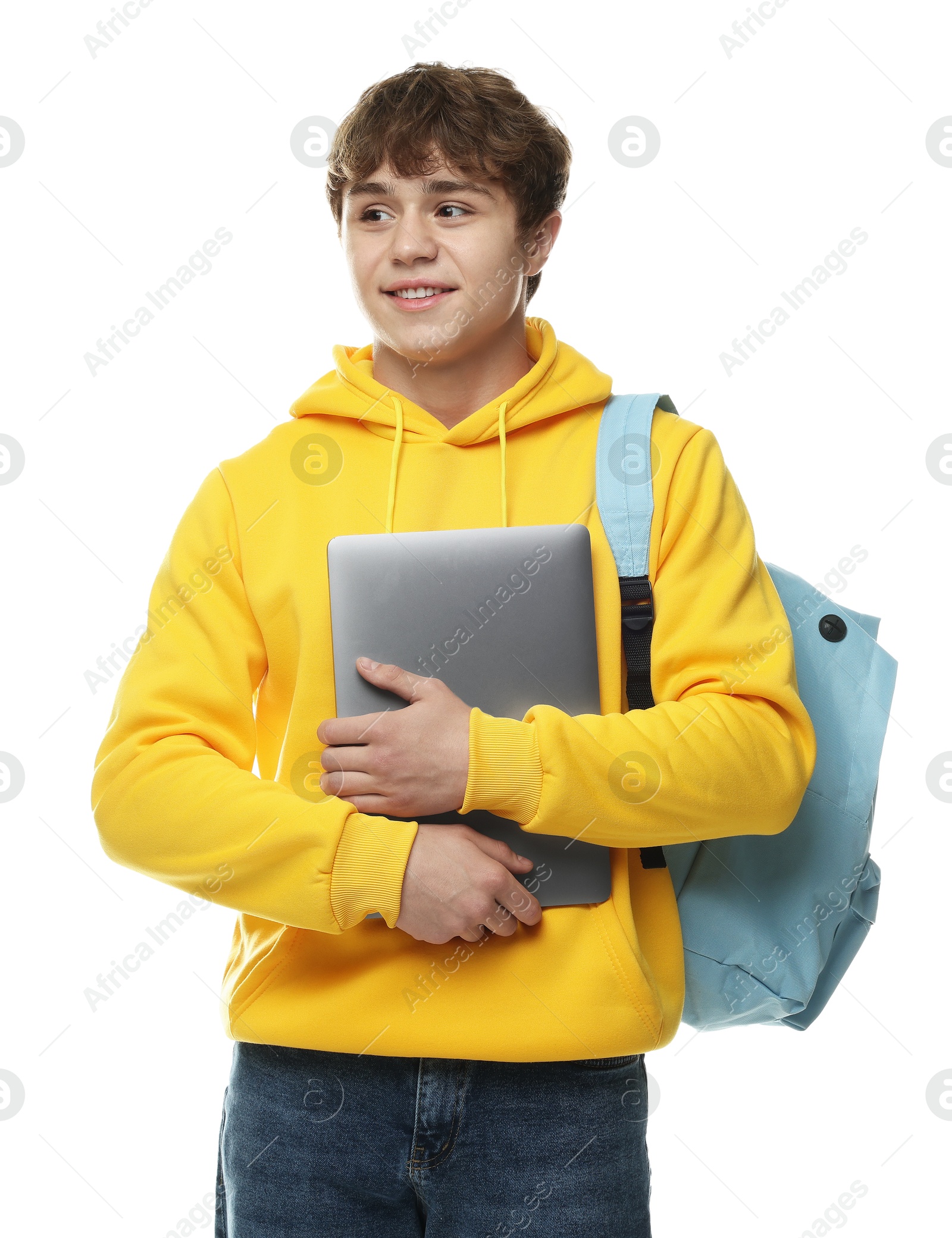 Teenage boy with laptop and backpack on white background Photo of Teenage boy with laptop and backpack on white background