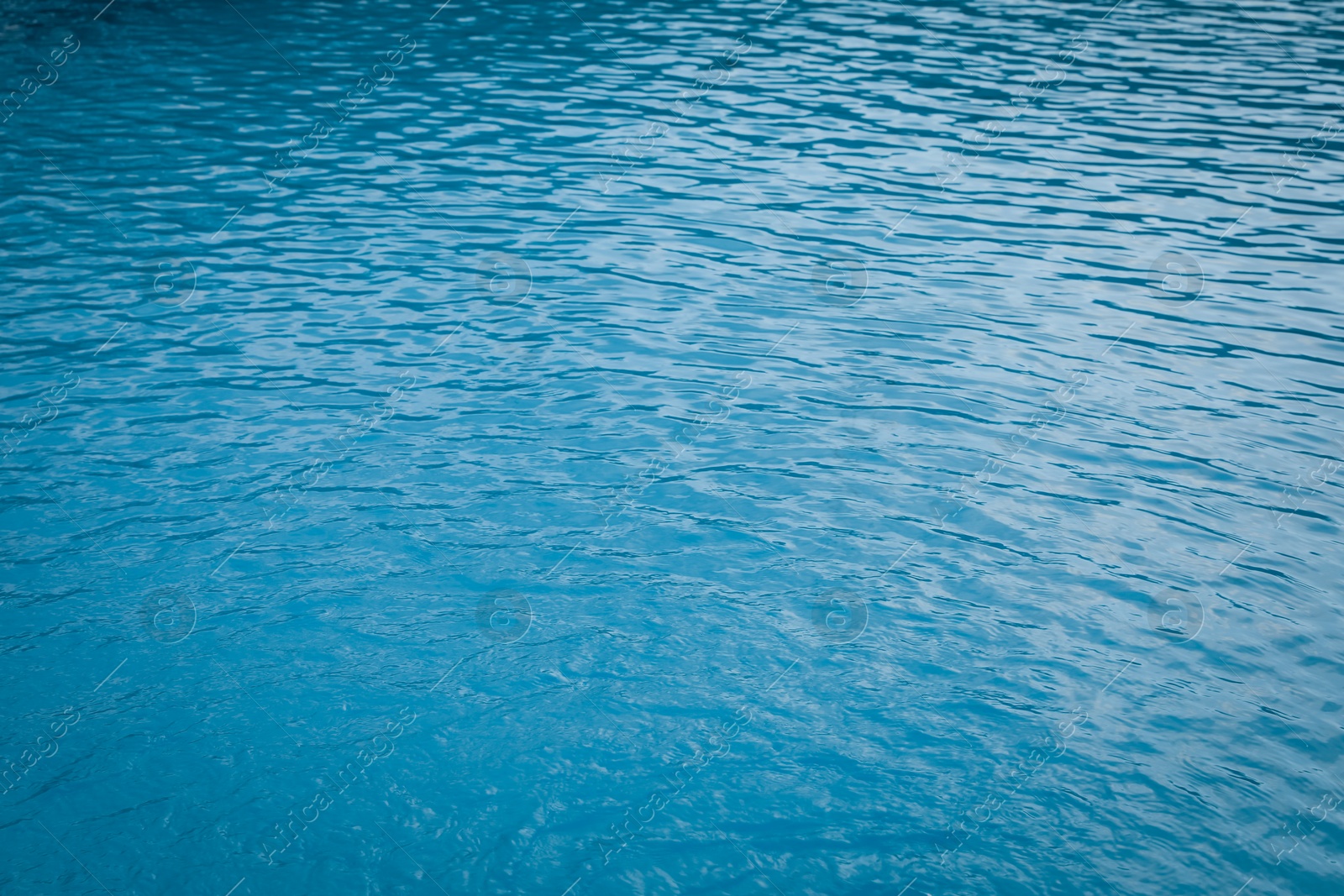 Clear water with ripples in outdoor swimming pool, closeup Photo of Clear water with ripples in outdoor swimming pool, closeup