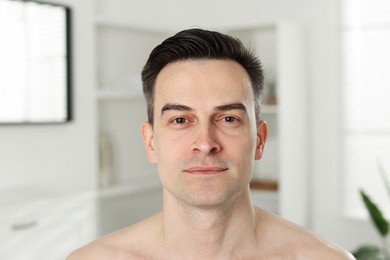 Photo of Portrait of handsome man after shaving at home