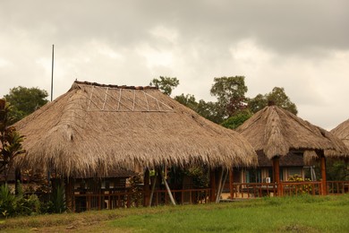 Photo of Beautiful gazebos with tables and chairs at resort