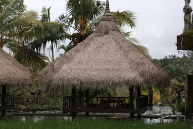 Photo of Beautiful gazebo with table and chairs outdoors