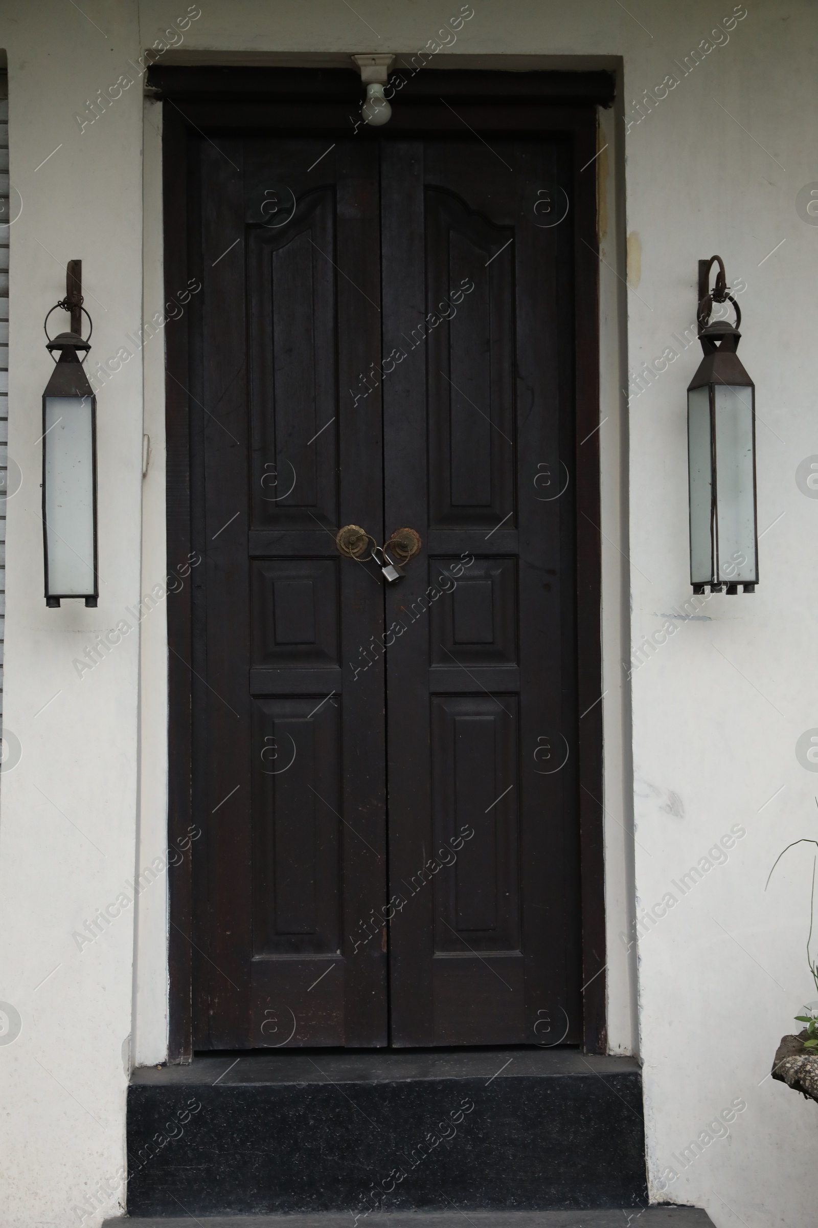 Exterior of building with black wooden door Photo of Exterior of building with black wooden door
