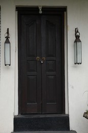Photo of Exterior of building with black wooden door