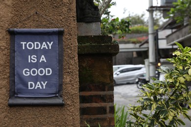 Photo of Sign with phrase Today is a good day on building outdoors
