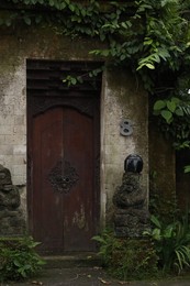 Photo of Bali, Indonesia - May 31, 2025: Beautiful Dvarapala statues near temple
