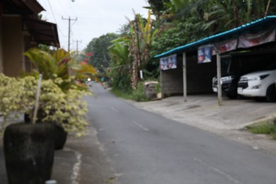 Photo of Blurred view of empty road in city