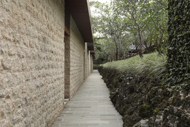 Photo of Bali, Indonesia - June 04, 2025: Beautiful building and green trees