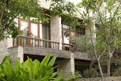 Photo of Bali, Indonesia - June 04, 2025: Beautiful building surrounded by different green plants