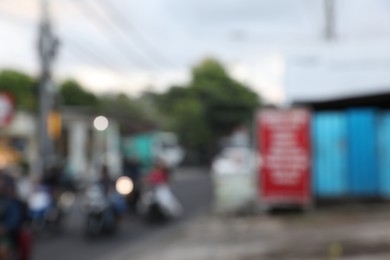 Photo of Blurred view of cars and buildings in city