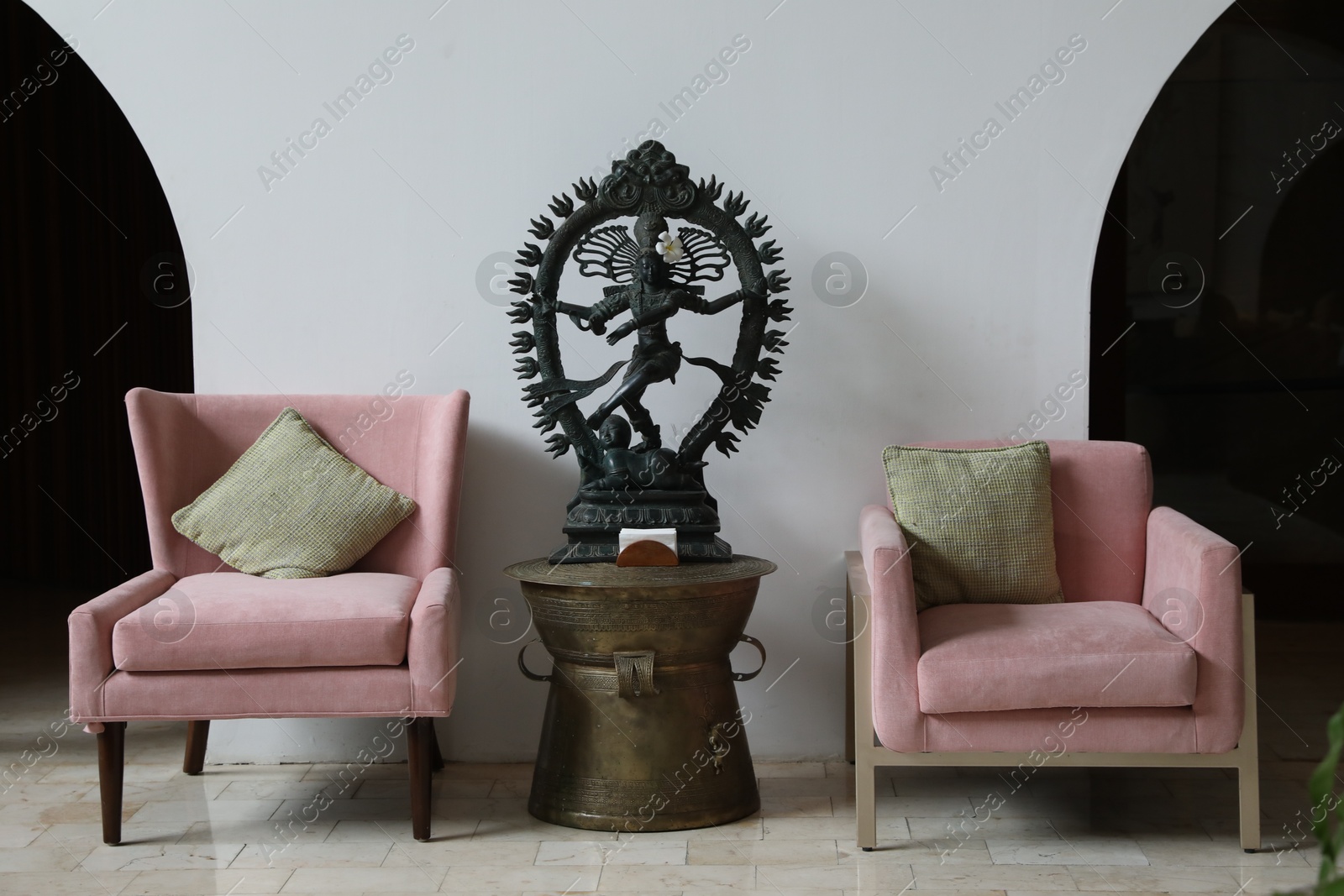 Bali, Indonesia - June 7, 2025: Stylish armchairs and Shiva Nataraja statue in hotel room Photo of Bali, Indonesia - June 7, 2025: Stylish armchairs and Shiva Nataraja statue in hotel room