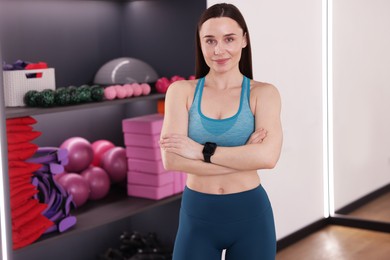Photo of Beautiful woman wearing sportswear in fitness studio