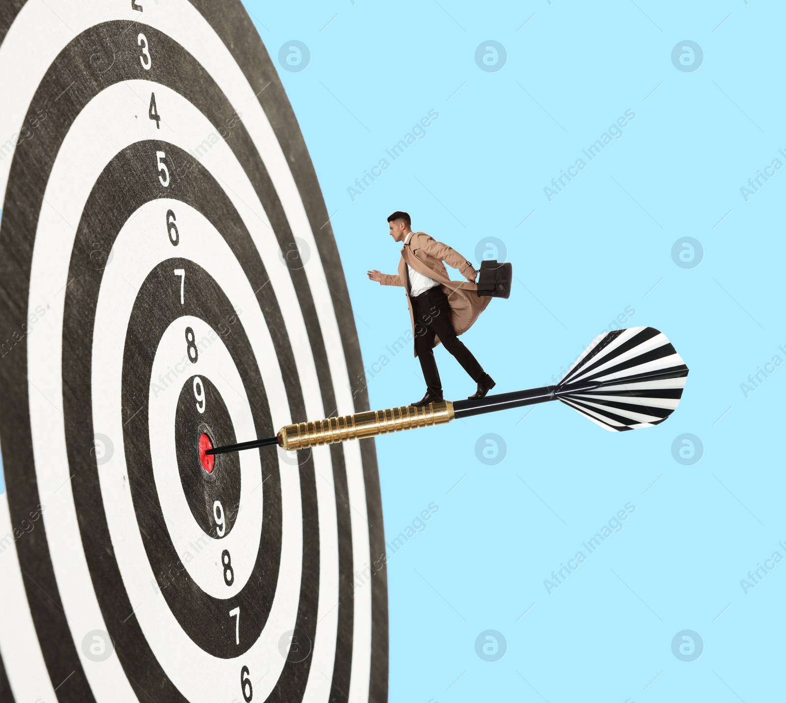 Targeting, goal achievement. Art collage with businessman walking on dart sticking in center of dartboard against light blue background Image of Targeting, goal achievement. Art collage with businessman walking on dart sticking in center of dartboard against light blue background