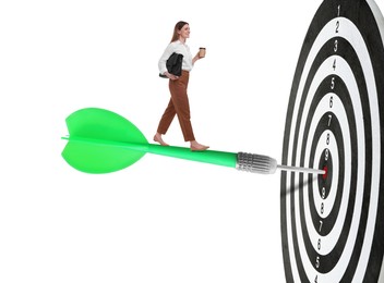 Image of Goal achievement, business success and targeting. Businesswoman walking on dart sticking in center of dartboard against white background