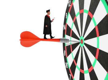 Image of Concepts of targeting, decision and goal achievement. Student with diploma after graduation walking on dart sticking in center of dartboard against white background