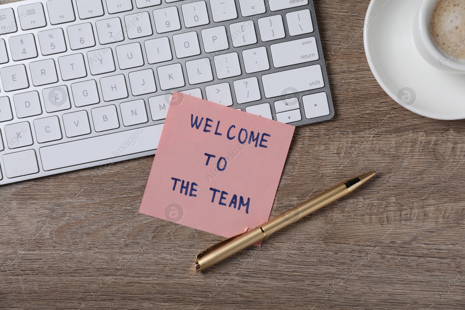 Paper note with words Welcome To The Team, pen and computer keyboard on wooden table, flat lay Photo of Paper note with words Welcome To The Team, pen and computer keyboard on wooden table, flat lay