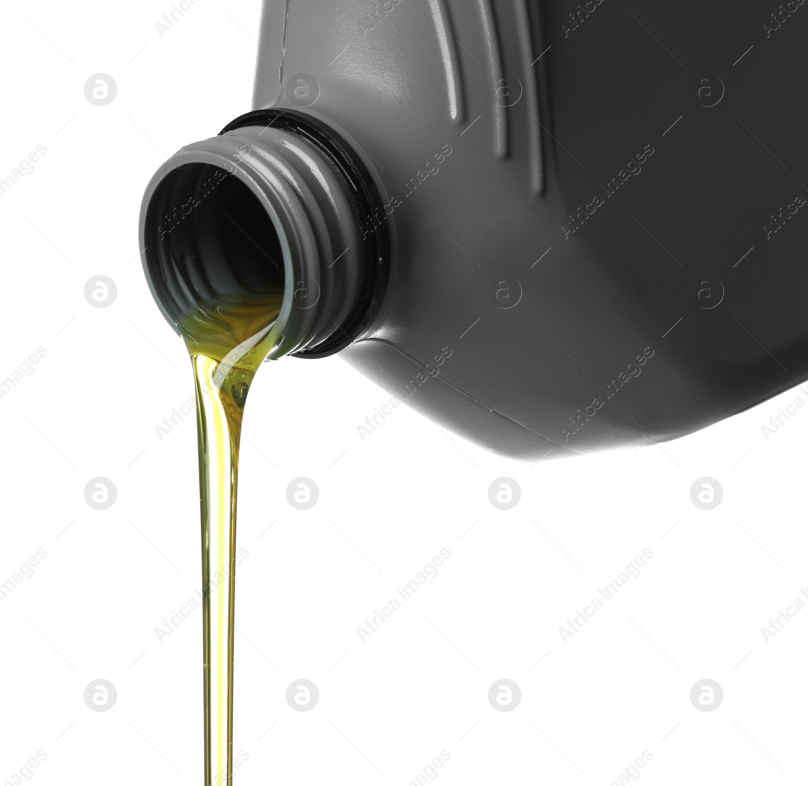 Pouring motor oil from grey canister isolated on white Photo of Pouring motor oil from grey canister isolated on white