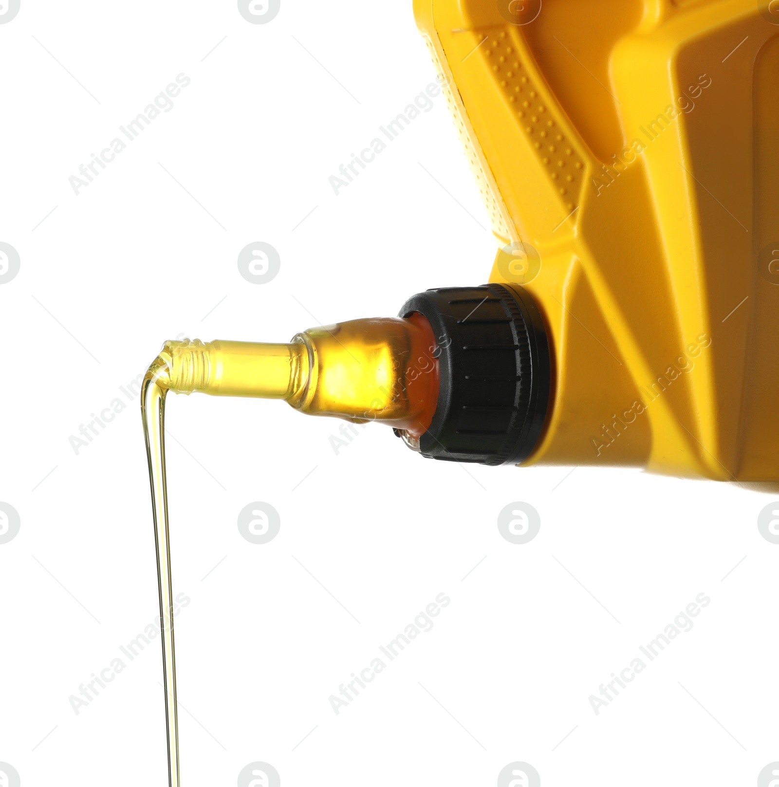 Pouring motor oil from yellow canister isolated on white Photo of Pouring motor oil from yellow canister isolated on white