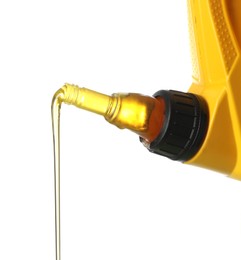 Photo of Pouring motor oil from yellow canister isolated on white