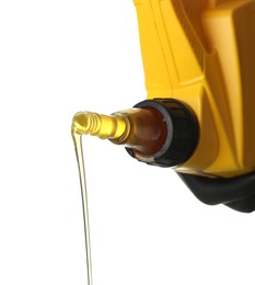 Photo of Pouring motor oil from yellow canister isolated on white