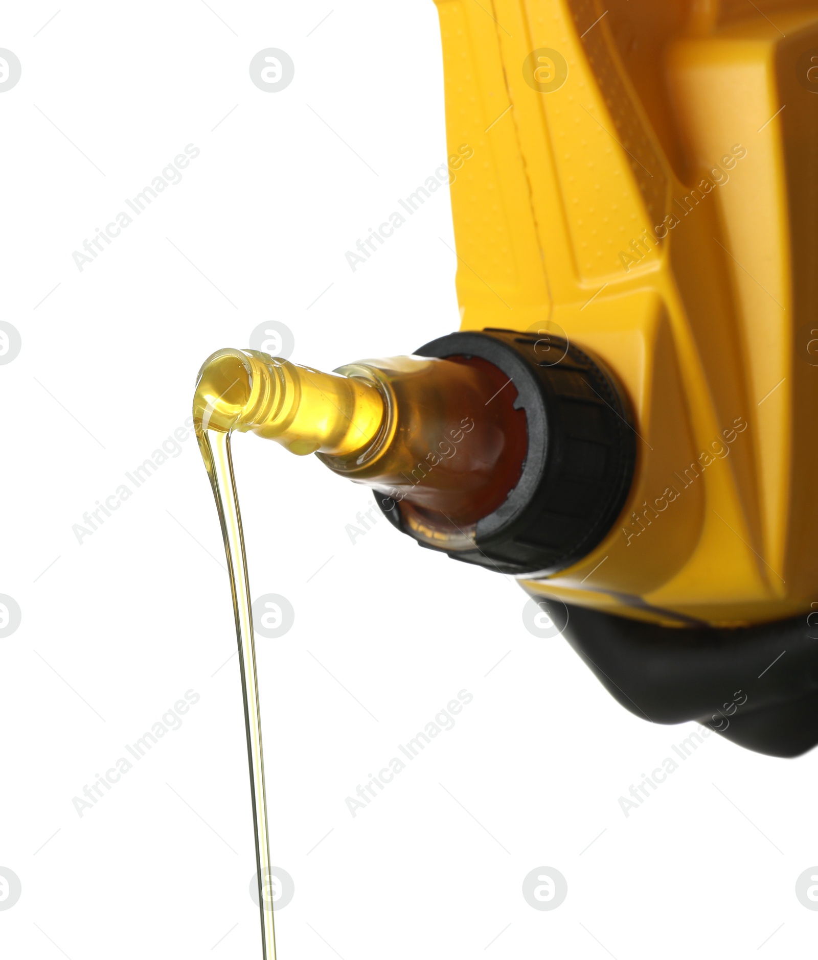Pouring motor oil from yellow canister isolated on white Photo of Pouring motor oil from yellow canister isolated on white