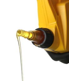 Photo of Pouring motor oil from yellow canister isolated on white