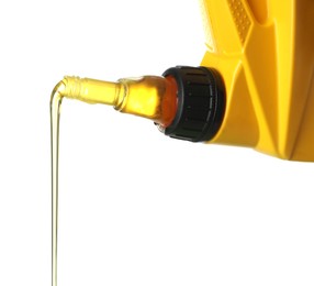Photo of Pouring motor oil from yellow canister isolated on white