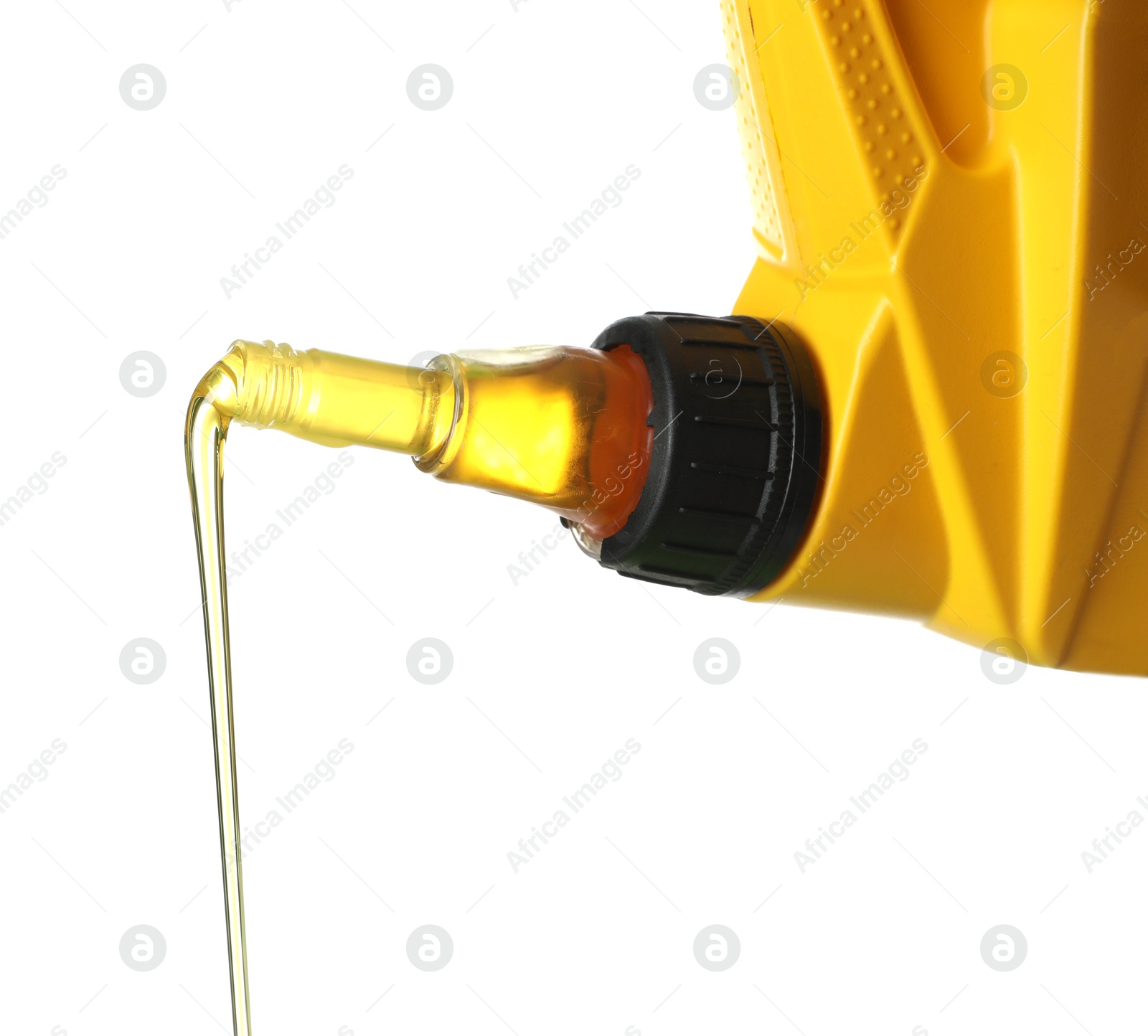 Pouring motor oil from yellow canister isolated on white Photo of Pouring motor oil from yellow canister isolated on white