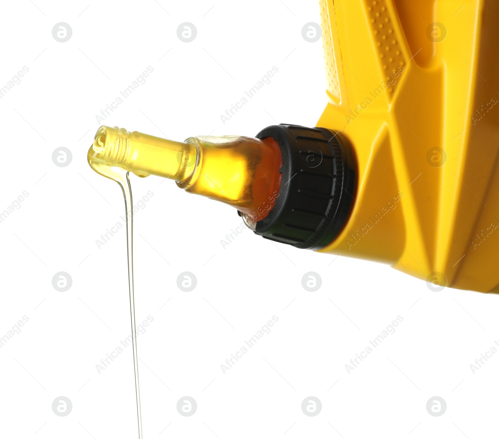 Pouring motor oil from yellow canister isolated on white Photo of Pouring motor oil from yellow canister isolated on white