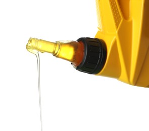 Photo of Pouring motor oil from yellow canister isolated on white