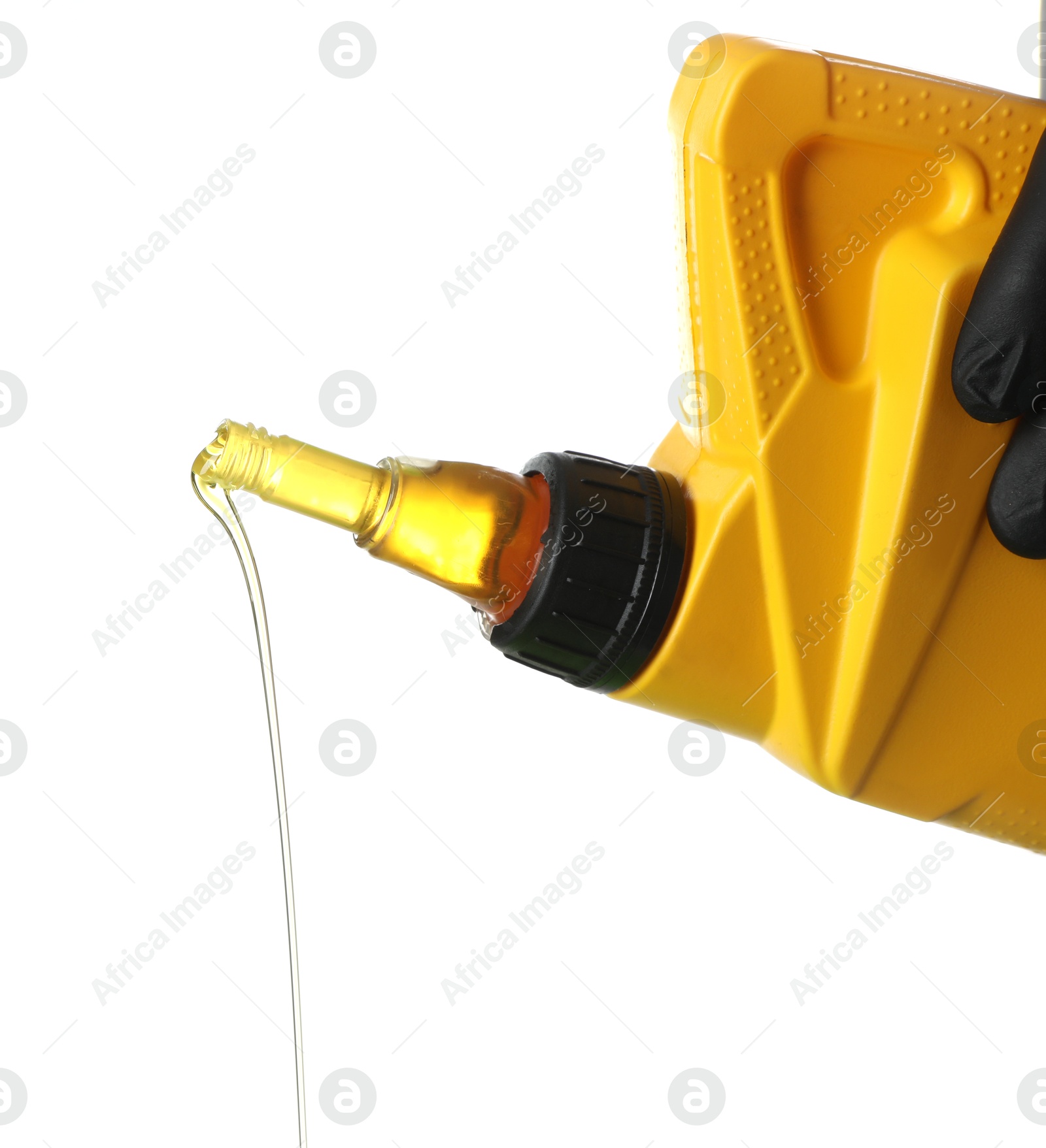 Man pouring motor oil from yellow canister isolated on white Photo of Man pouring motor oil from yellow canister isolated on white