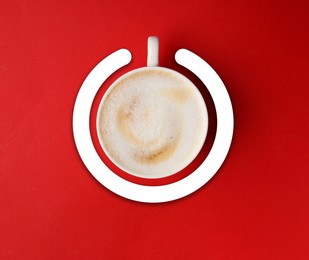 Image of Cup of coffee and circle combined into power symbol on red background, top view