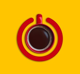 Image of Cup of coffee and circle combined into power symbol on yellow background, top view