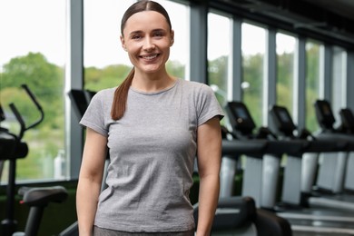 Photo of Portrait of personal trainer in sport center