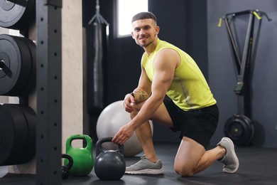 Photo of Personal trainer with sports equipment in gym