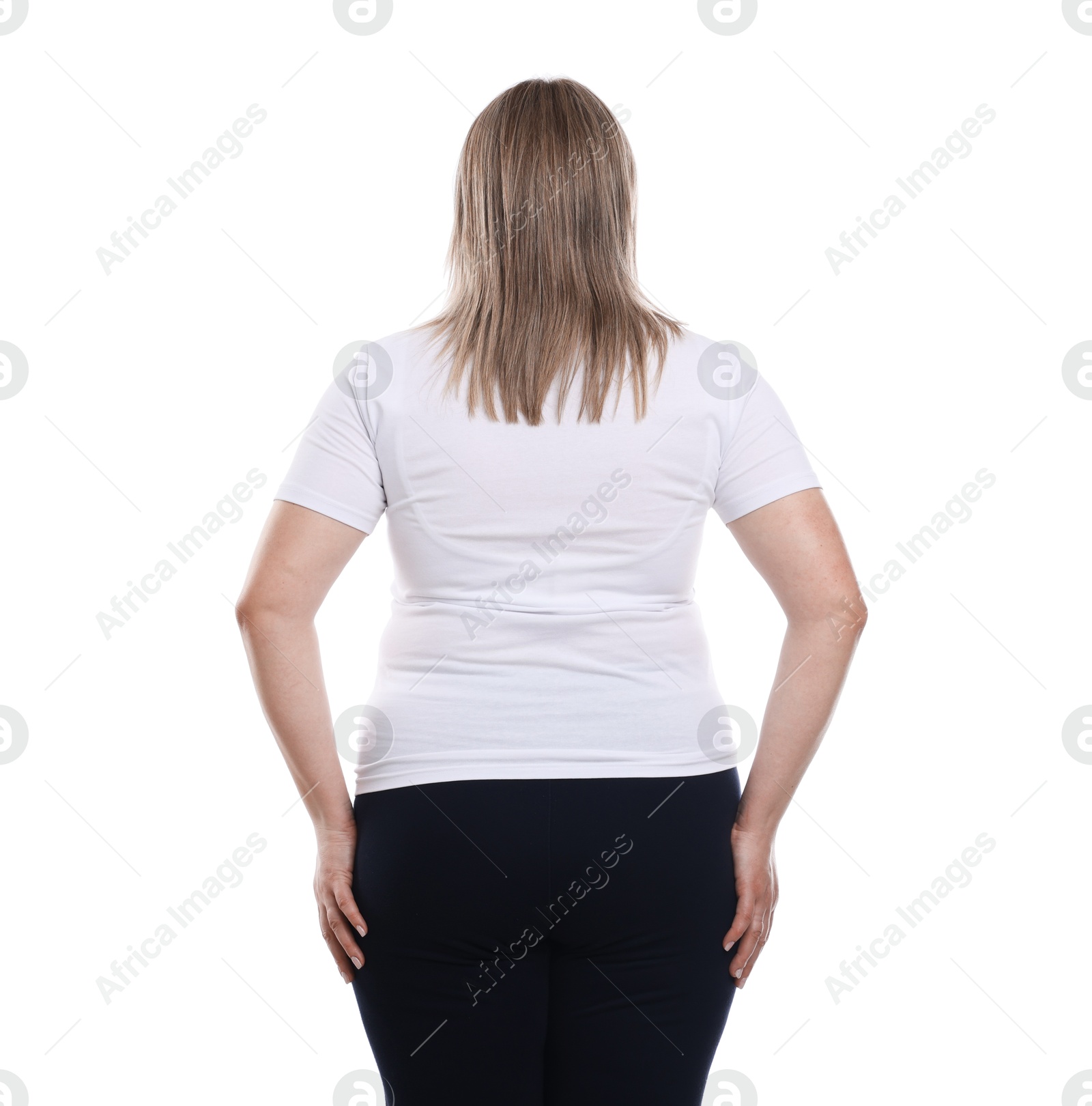 Weight loss. Plus size woman on white background, back view Photo of Weight loss. Plus size woman on white background, back view