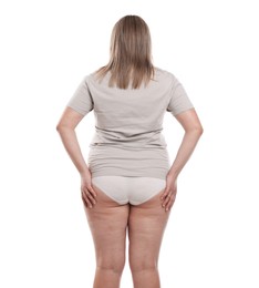 Photo of Weight loss. Plus size woman on white background, back view